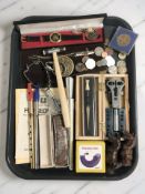 A small group of coins, wristwatch, tools including a ring sizer, watch case opener,