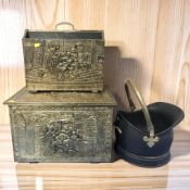 An embossed brass coal box, magazine rack and a coal helmet.
