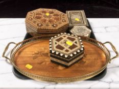 A group of Indian bone and mother of pearl inlaid trinket boxes, a brass galleried serving tray,