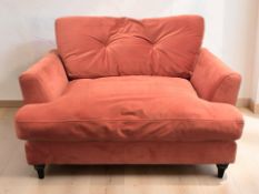 A contemporary two seater settee in pale red fabric, width 133 cm.