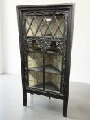 A Victorian carved and ebonised corner cabinet, height 157 cm.