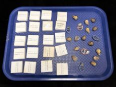 A group of Civil Defense Corps enameled badges.