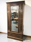 An early 20th century mahogany single mirror door wardrobe, 93 cm x 62 cm x 206 cm.