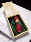 A Swatch watch 'Holly Joy Christmas 2004'.