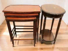 A reproduction nest of three serpentine tables, width 60 cm,