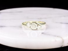 An 18ct gold and platinum three stone diamond illusion-set ring,