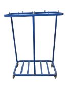 A metal trolley on castors, width 77 cm.