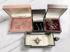 A silver garnet pendant and matching earrings, a pair of faux opal earrings,