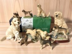 A collection of dog ornaments including Border Fine Arts, Country Artists, etc.