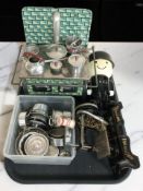 A miniature sewing machine, miniature tin plate stove with various pans, etc.
