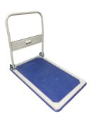 A Manutan flat bed trolley, length 90 cm.