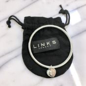A Links of London silver hoop bangle with heart-shaped charm, diameter 62mm, with cloth pouch.