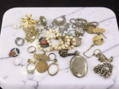 An antique silver locket, several dress rings, various medals, silver chain,