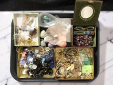 A collection of costume bead necklaces, bangles, polished egg ornaments, dress rings, etc.