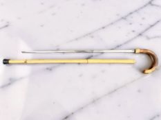 A sword stick, with 64cm etched and fullered steel blade marked 'Toledo', overall 89cm.