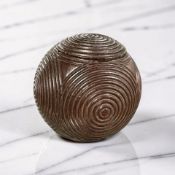 A 19th century spherical treen nutmeg grater, carved all over with concentric circles, diameter 4.