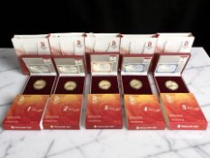 Five Beijing 2008 Olympics gold plated commemorative coins.