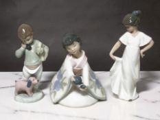 Three Nao figures of children.