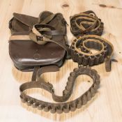 A leather cartridge bag, canvas bag and three cartridge belts.