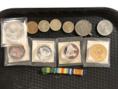 A small group of collector's coins, medal ribbon bar, etc.