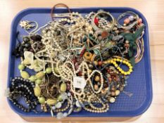 A quantity of costume jewellery, necklaces, faux pearls, beads, etc.