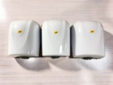 Three hand soap dispensers.