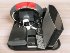 A Bose sound dock portable digital music system, a further Bose speaker and a Pure digital radio,