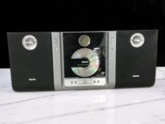 A Philips micro system MC235B, with leads.