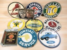 A group of reproduction enameled motoring signs.