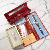 A Swatch Watch 'Love Layers', another 'Heartbeat', and a pair of Swatch watch cuff links.