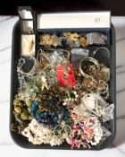 A collection of costume bead necklaces, decorative bangles, brooches, etc.