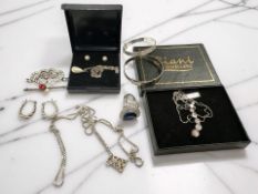 A group of silver and white metal jewellery, two small bangles, dress ring, chains,