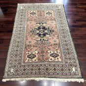 A Caucasian rug, 137 cm x 210 cm.