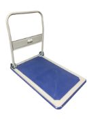 A Manutan flat bed trolley, length 90 cm.