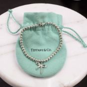A Tiffany & Co silver bow bracelet, length 17cm, with Tiffany pouch.