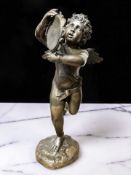 A contemporary hollow cast patinated bronze figure of a winged cherub musician playing a tambourine,