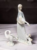 A Lladro figure of a lady holding a goose No. 4860, and a further figure of a goose.