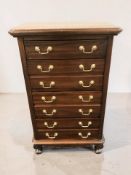 An eastern hardwood seven drawer tall boy, width 67 cm.
