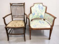 An Edwardian inlaid mahogany armchair and a further armchair in floral fabric.
