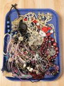 A quantity of costume jewellery, necklaces, faux pearls, beads, etc.