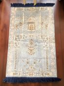 An Egyptian machine-made prayer rug,