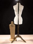 An adjustable dressmaker's mannequin form, and a further wooden mannequin stand.