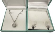 A pair of silver and CZ snow flake ear studs,