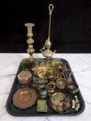 Assorted brass and copper wares including candlestick, oil lamp, miniature tripod chess board table,