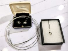 Three silver chokers, a pendant on chain,