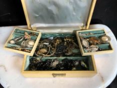 A jewellery box containing assorted costume jewellery, wristwatches, brooches, bangles,
