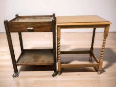 A mid-century oak trolley, width 54 cm, and a barley twist table.