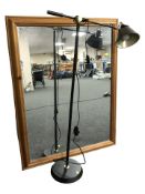A modern pine framed mirror, 113 cm x 88 cm, together with a standard lamp.