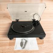 A Technics SL-1500C direct drive turntable system, with lead and instructions.