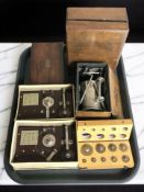 Two morse code tapping machines, graduated set of brass precision weights,